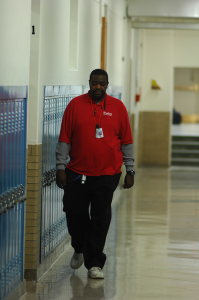 A security guard walks past Room 131 Nov. 13.