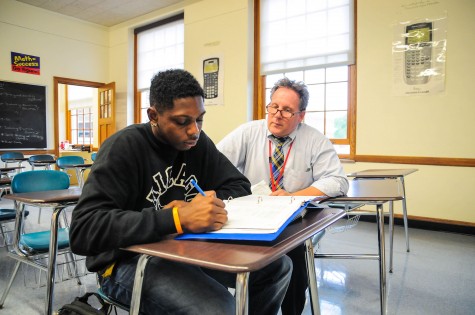 Math teacher Tom Anderson helps senior Brandon Draper during conferences Sept. 11.