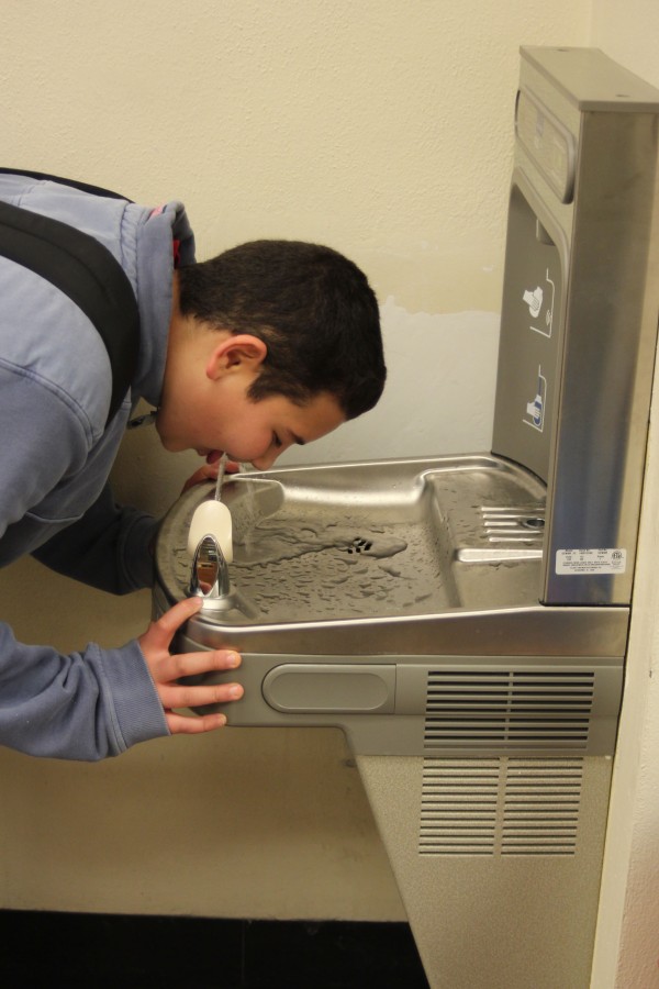 Sophomore Danny Mathakour drinks from the new main office water fountain.