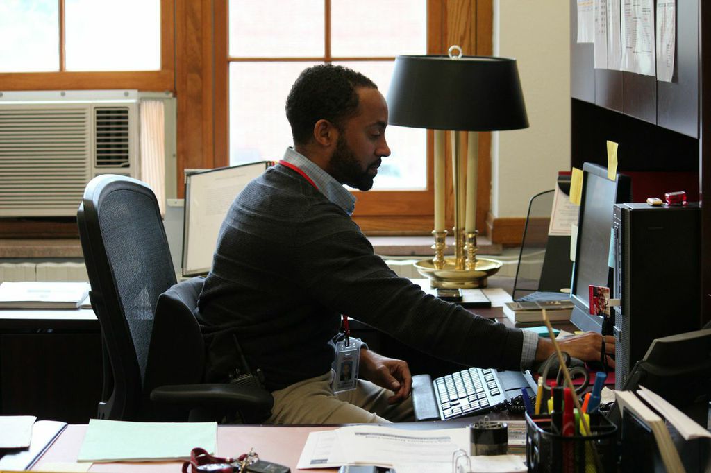 Dean of Students Jon Moorehead works at his office computer. Moorehead addresses
low-level behavioral offenses and will help to establish a restorative justice program at the high school.
