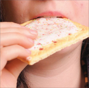 A student eats a Pop-Tart, a popular on-the-go breakfast item and a favorite in high school vending machines. However, with 15 grams of sugar apiece, Pop-Tarts are not advisable for a healthy breakfast.