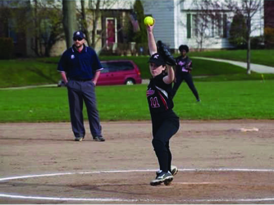 Freshman Ellen Meyerhoefer winds up a pitch during a game.
