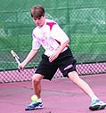 Freshman Wilder Geier returns the ball during a rally.