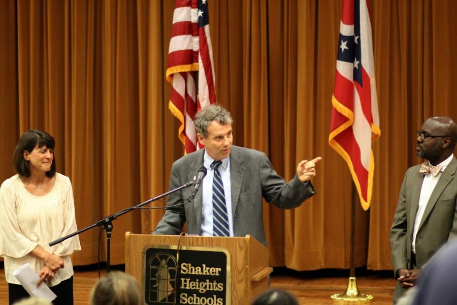 Sen. Sherrod Brown, flanked by English teacher Jody Podl and Superintendent Gregory C. Hutchings, Jr.,  promotes the SMART Act, legislation designed to curb standardized testing in public schools, today during a press conference in the high schools small auditorium. 