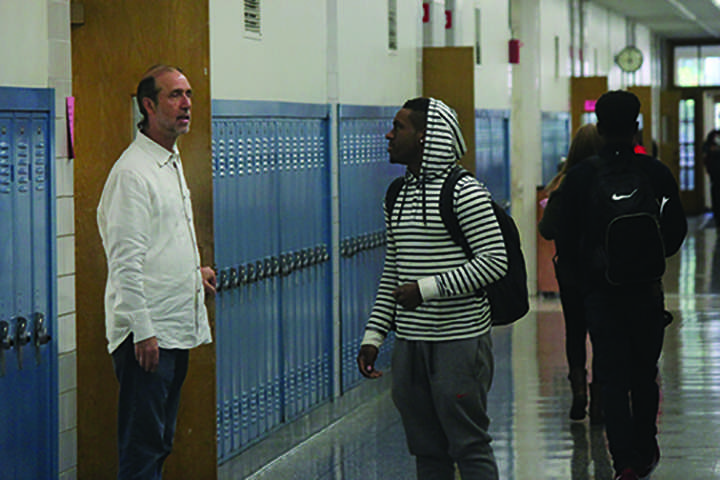 Tony Cuda welcomes students into class prior to the tardy bell. Teachers are instructed to shut their doors to late students after the bell sounds.