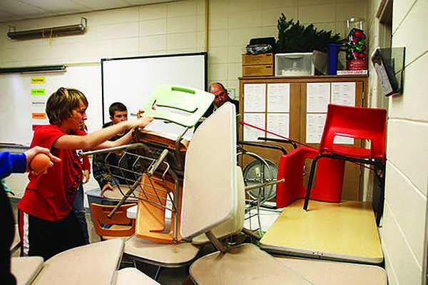 Students at Richland Junior High in Essex, Missouri barricade a classroom door during ALICE training session. Shaker previously considered this 
training to teach students how to react to an intruder.