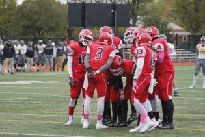 The Raider football team huddles before a play Oct. 3.