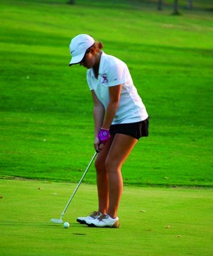 Sophomore Maggie Dant prepares to swing during a tournament. 