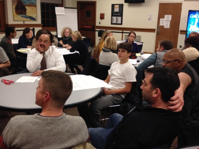 Members of the high school group discuss ideas for updating facilities