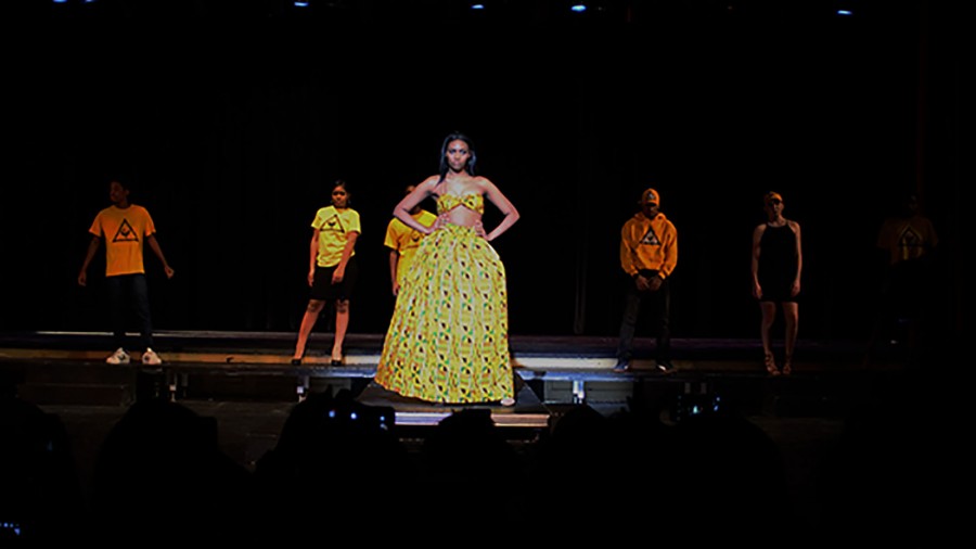 Junior Vance Fleming, freshman Daian Phillips, senior Morgan Owners, junior Phanawn Bailey and junior Britta Nelson modeling yellow outfits from the African-American Cultural Gardens scene. 