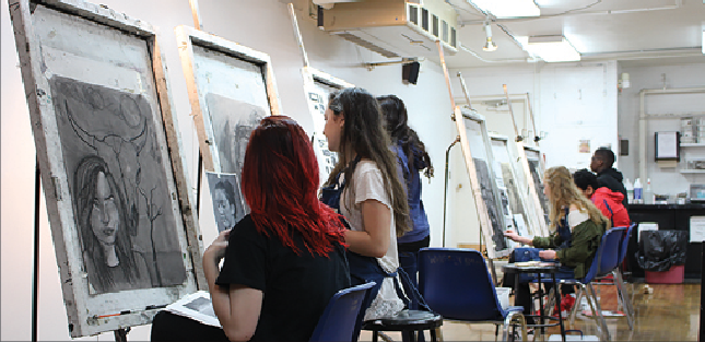 First period Honors Drawing students Payton Clark and Sophie Browner work on their self-portrait assignment. Though Shaker does not offer STEAM-structered courses, there is an extensive arts program.