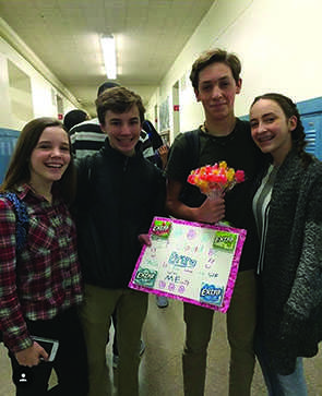 Freshman Caroline Kiker and Caroline Wollman asked Trent Meyer and Nathan Murray to winter formal by writing a gum-inspired pun on a poster. 