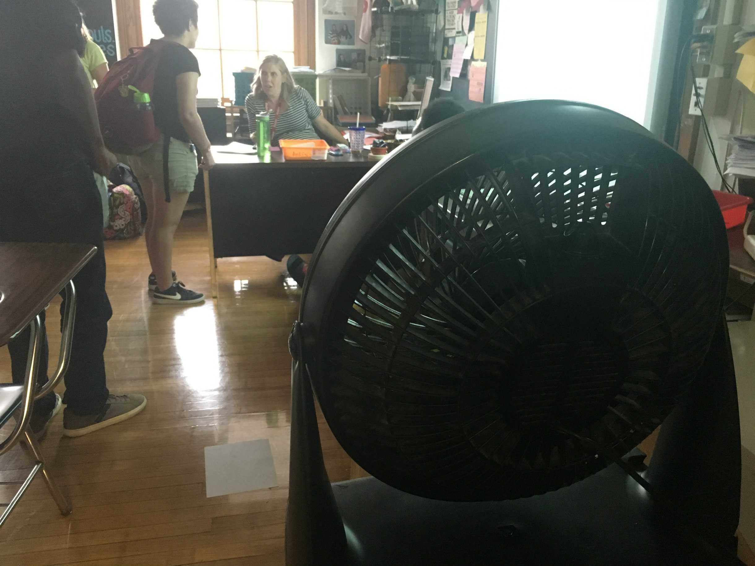 Students in history teacher Amanda Ersek's conference period sweat in the intense heat despite a fan.