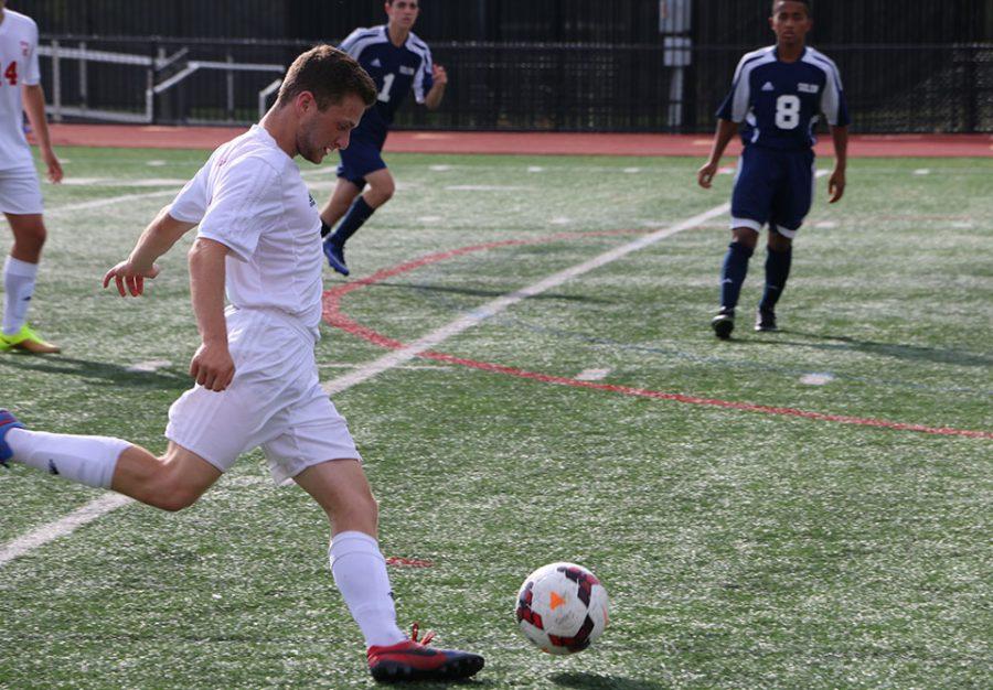 Senior forward Andrew Roth drives the ball forward during a 2-0 win against Solon.