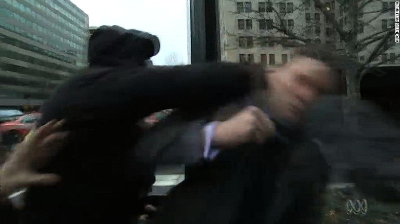 A protestor punches alt-right leader Richard Spencer during Spencers Jan. 20 interview with the Australian Broadcasting Company.