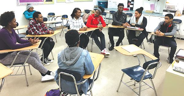 Members of the high school’s chapter of the NAACP engage in discussion in Room 157. “Through the [NAACP’s] Race and Culture Committee, we’ll be doing different discussions and different activities, maybe even field trips, based around bringing racial and cultural awareness,” said Siraj Lee, senior and NAACP leader.