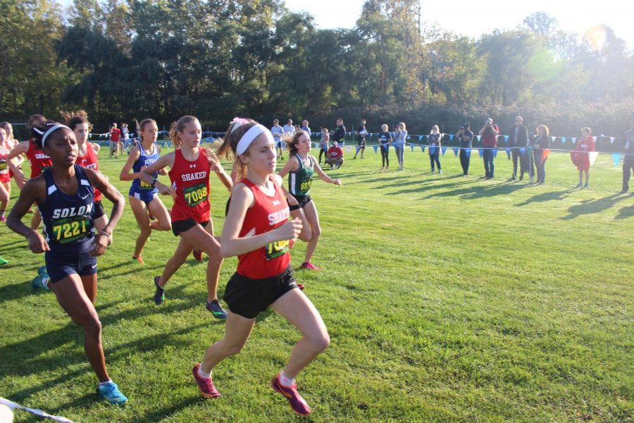 Cross country senior Sophie Carrier leads the pack at the conference meet Oct. 14. They take serious responsibility in the fact that they are carrying on a tradition,” cross-country coach David Englander said.