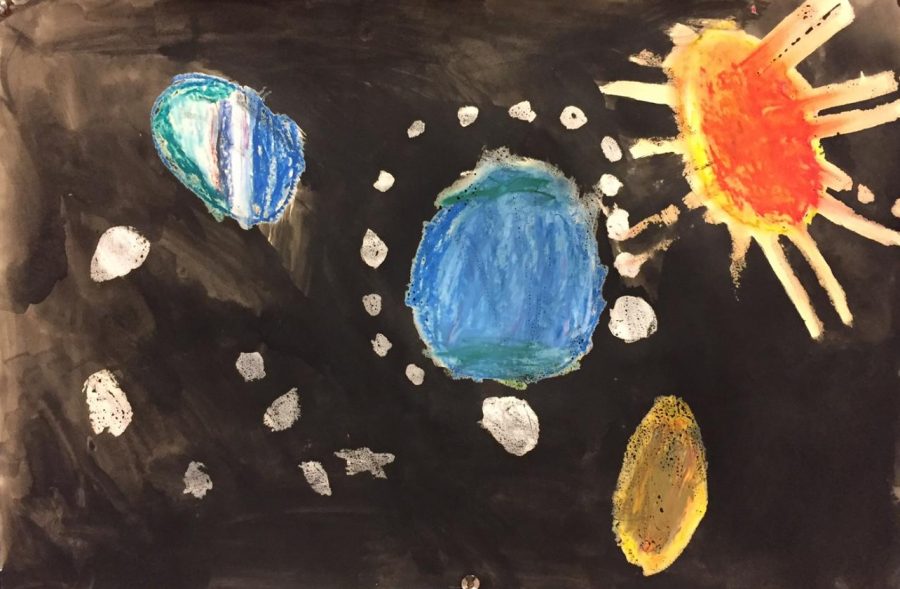 Elementary school students painted pictures of space that were displayed outside the large auditorium.