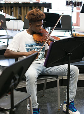 Freshman Dejonte Lawrence practices violin.