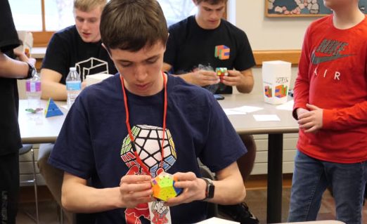 Lewicki solves a megaminx puzzle at a Shaker Heights cubing competition. “I practice all day at every possible moment,” Phillip said. “I want to break the world record in at least one event. I want to be competing for world championship podiums for my main events.”