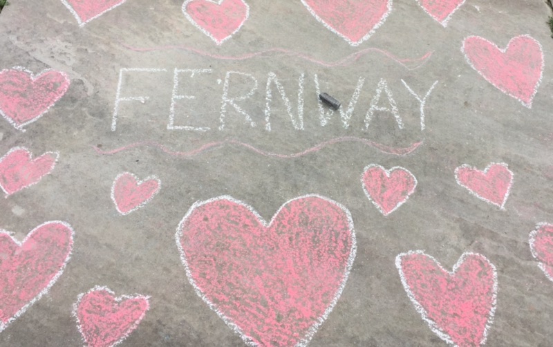 Fernway neighborhood residents wrote and drew about their love for the school on the surrounding sidewalk in chalk.