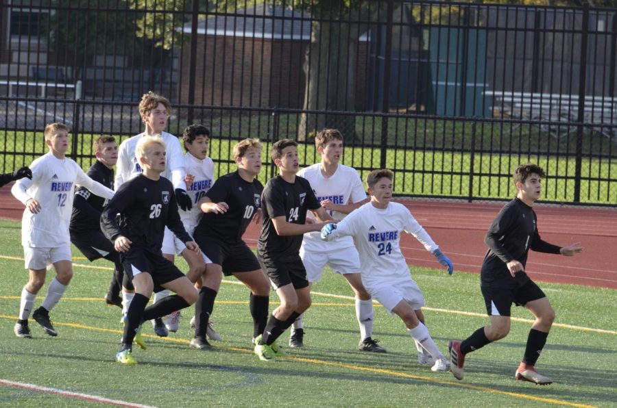 Varsity boys soccer team prepares for the incoming corner kick. They faced the Revere Minutemen on Oct. 13.