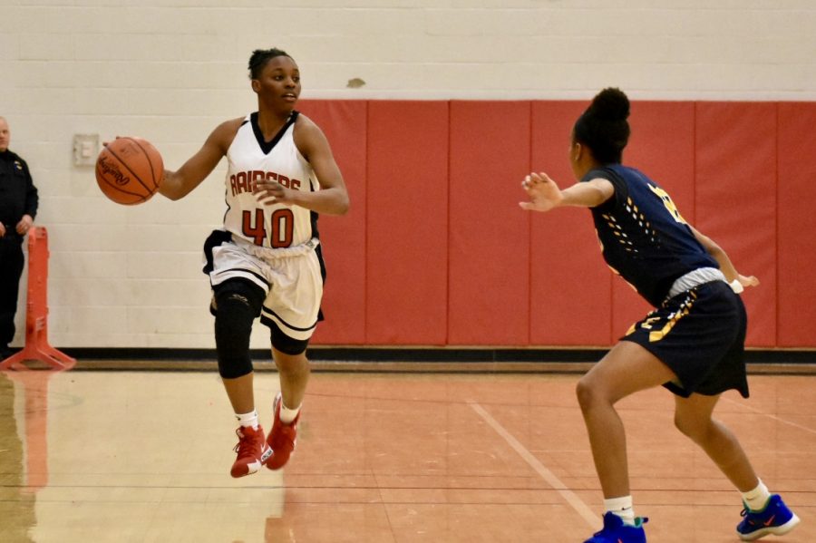 Senior Anajiah Wallace takes the ball up the floor against Euclid this past Wednesday. 