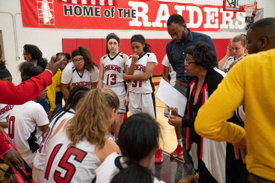 Former head coach Denise Duncan talks to the team during a timeout.