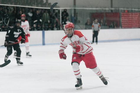 Josh Floyd wears the hockey team’s white uniform, one of their three sets, when playing University School.