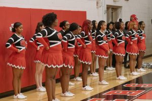 The majority black raider cheerleaders rally on the
sideline during a Jan. 8 home game against Euclid.