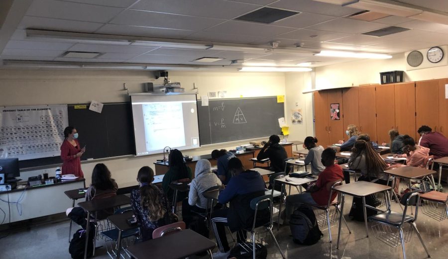 Science teacher Megan Dora teaches her freshman Physical Science class, preparing them for their next test