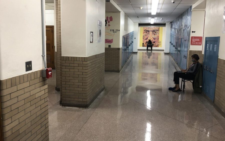 Assistant Principal Rebekah Sharpe sits, monitoring the hallways near the second floor fire alarm that was pulled