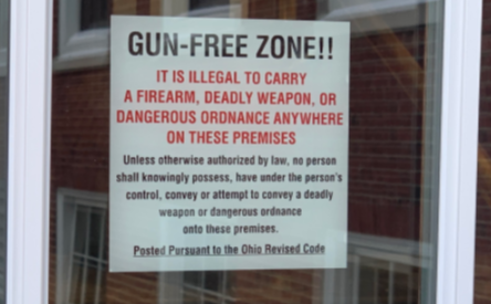 Gun-Free Zone signs are posted at high school building entrances