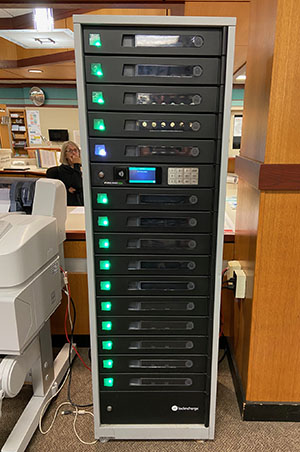 The secure charging cabinet located in the library by the circulation desk allows students to quickly charge devices. 