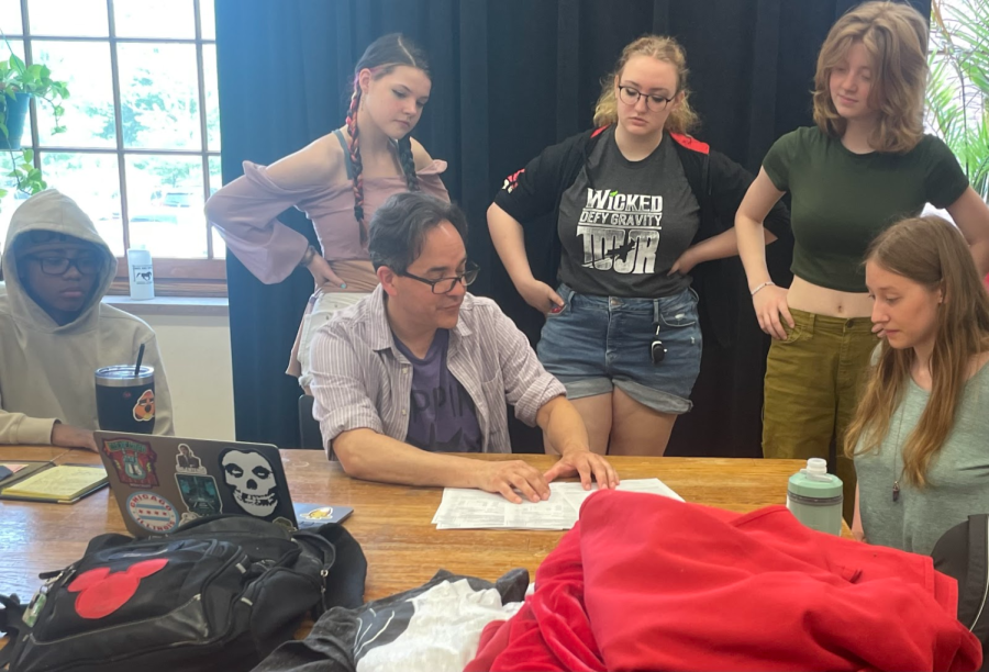 Theater Department Chairman Scott Sumerak works with students during Theater Management class in Room 128, May 23. Theater Management is one of the classes affected by the 15-student enrollment requirement and will be stacked, or combined, with Stagecraft class during the same class period next year.
