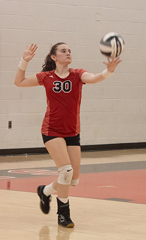 Junior Ava Bribriesco prepares to serve. The womens volleyball team, aiming to improve on a slow start to the season, plays Medina tonight at home.  