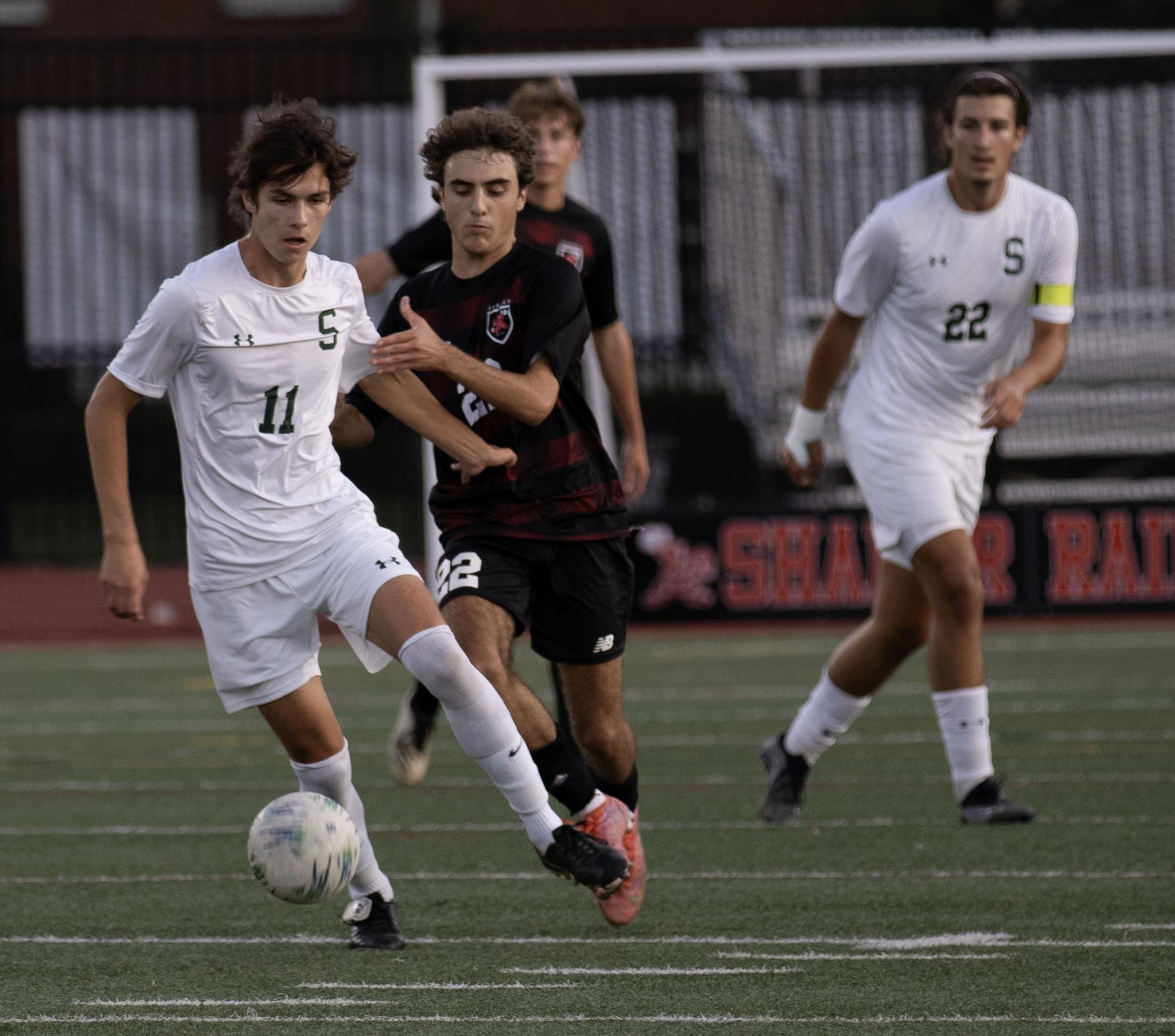 Senior Jack Landever pursues a Strongsville opponent during the Raiders 2-0 conference win Sept. 12 at Russell H. Rupp Field. Fall sports teams are finding their way in the GCC. 