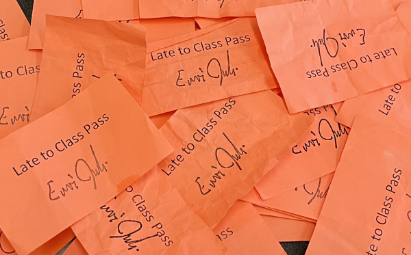 A collection of used late to class passes. In order to enter class late, students must receive a pass from a security guard or administrator in the hallways. Teachers collect the passes and return them to the office for reuse. 