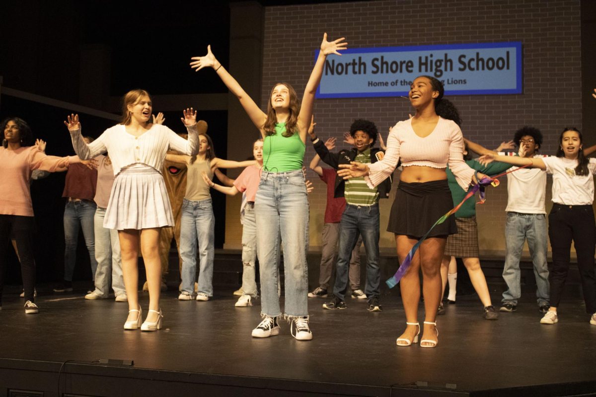 Sophie Watkins, Isabel Siegel and Cassie Lyles prepare for their first performance at the show’s final dress rehearsal yesterday evening in the Large Auditorium. 