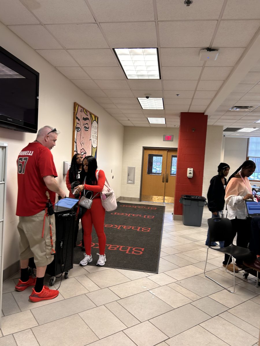 Dean of Students Greg Zannelli hands out late passes at 8:30 a.m. April 5 