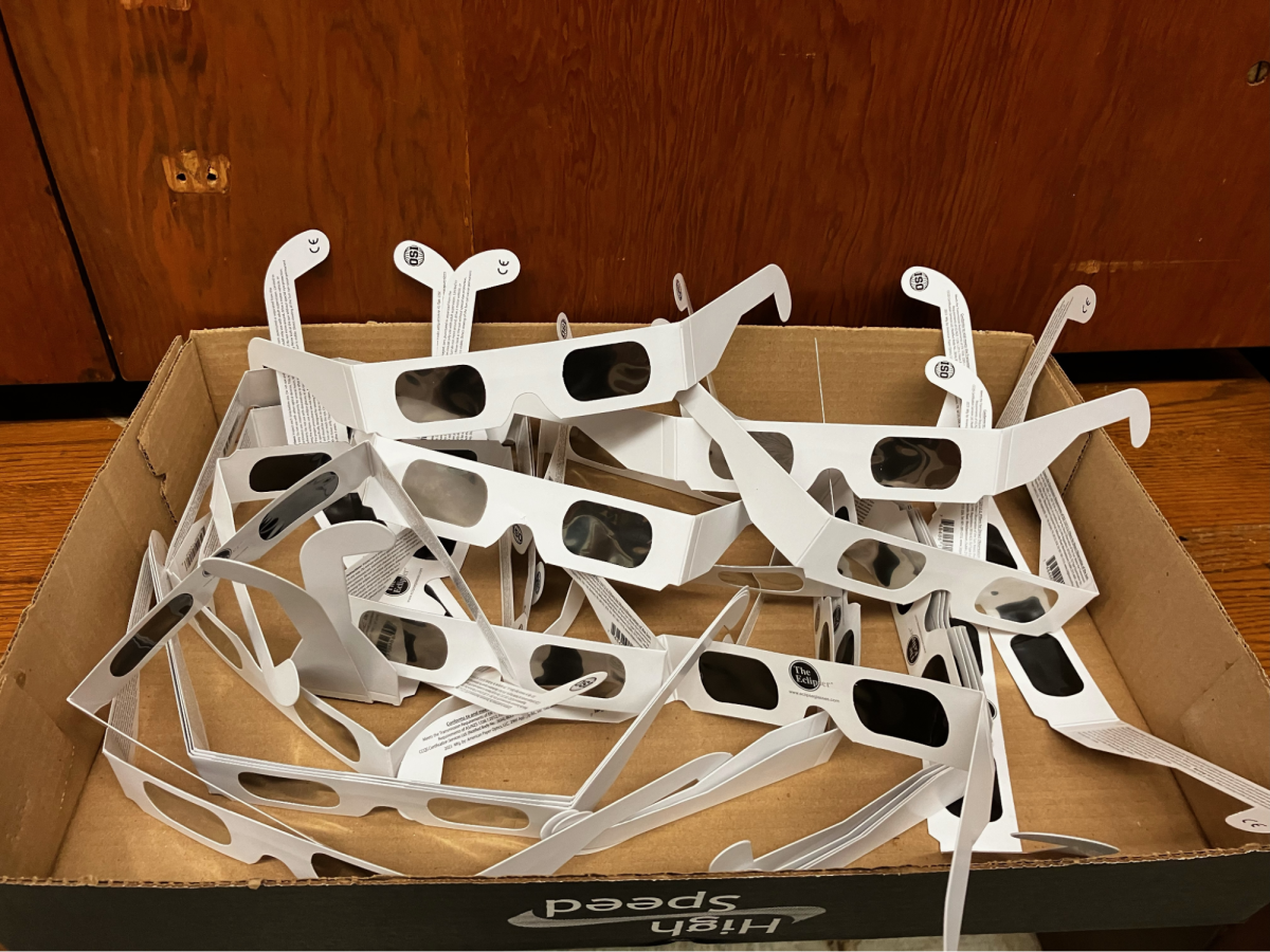 Eclipse glasses, which make it safe to observe the eclipse without risking eye damage, were distributed to students Tuesday during Crew.