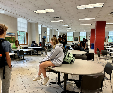 Students without an ID badge wait in the lower cafeteria at 8:15 a.m Monday May 6. Those who did not have IDs remained there until they received replacements and were dismissed to class near the end of the period.