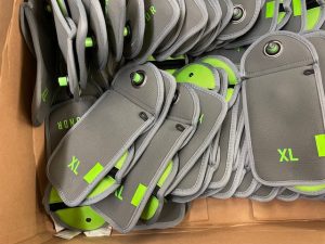 Yondr pouches awaiting distribution before the beginning of school in 2024. The personal electronic device policy is a state mandate, but the decision to use lockable phone storage was the district's, chosen in part to limit phone use to document and encourage fighting.