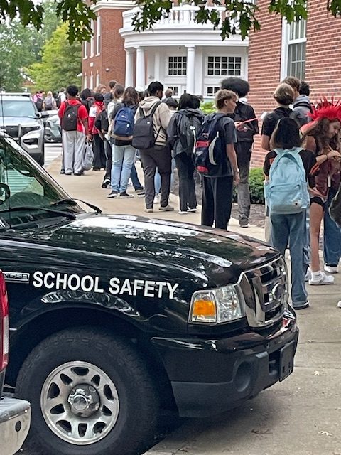 The line of students awaiting bag checks and metal detection by wand Sept. 27 at 8:34 a.m. extends the length of the front parking lot sidewalk. School begins at 8:20 a.m.