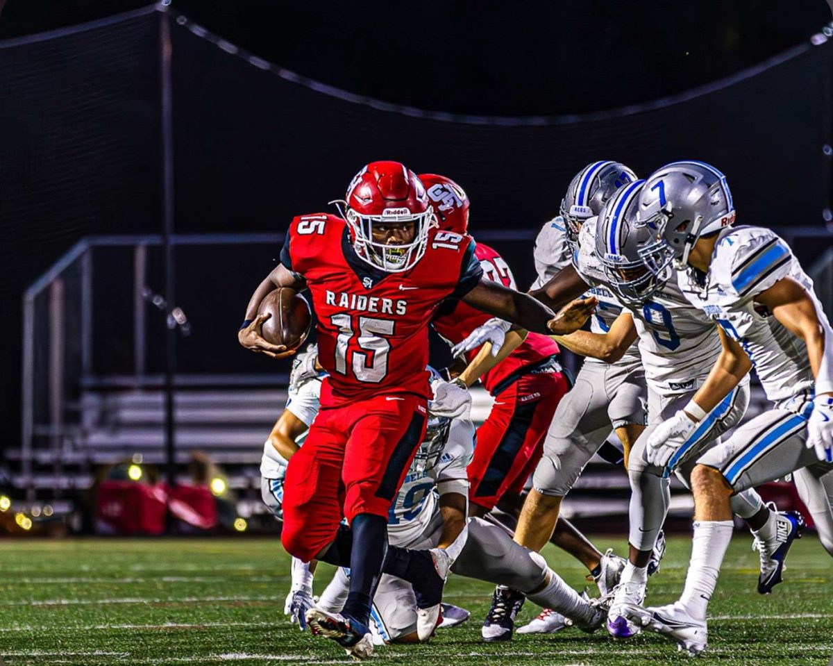 Beard evades Willoughby South defenders Aug. 23 at Russell H. Rupp Field