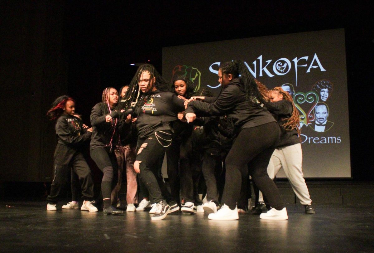 Junior Amani Smith, sophomore Sumaiyah Lakes and seniors Brianna Hill and Chloe Harper and other Sankofa dancers perform a dance to Beyonce’s “Freedom.”