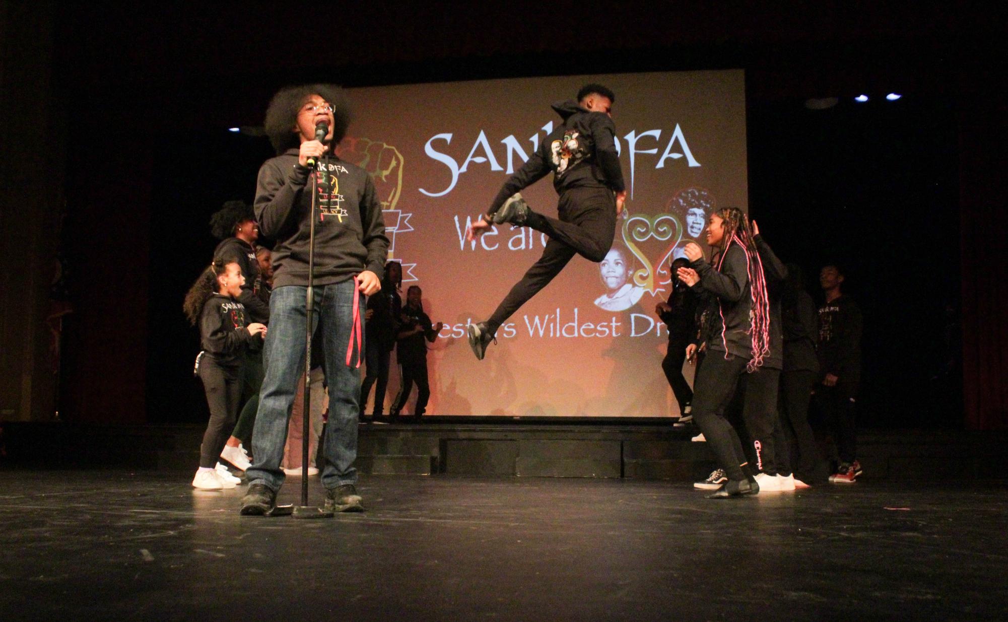 Sophomore Daniel Bowen sings while sophomore Luvirt Parker and Sankofa members dance to “This is How We Do It” by Montell Jordan.