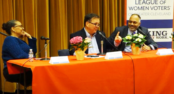 Panelists Lila Mills and Mike McIntyre laugh as Subodh Chandra jokes that McIntyre's political views are impossible to determine. This moment, part of a broader discussion about the role of opinions in journalism, occurred during a League of Women Voters' forum April 16 in the high school's small auditorium. Courtesy of LWV.