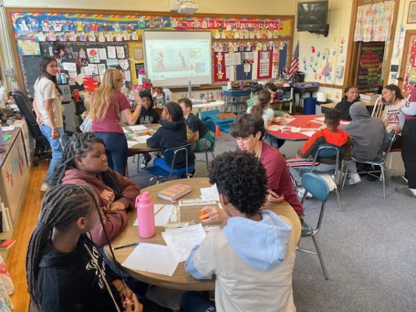 Student Group on Race Relations students visit an elementary school classroom this year.  The group is among the district’s identity-based organizations.