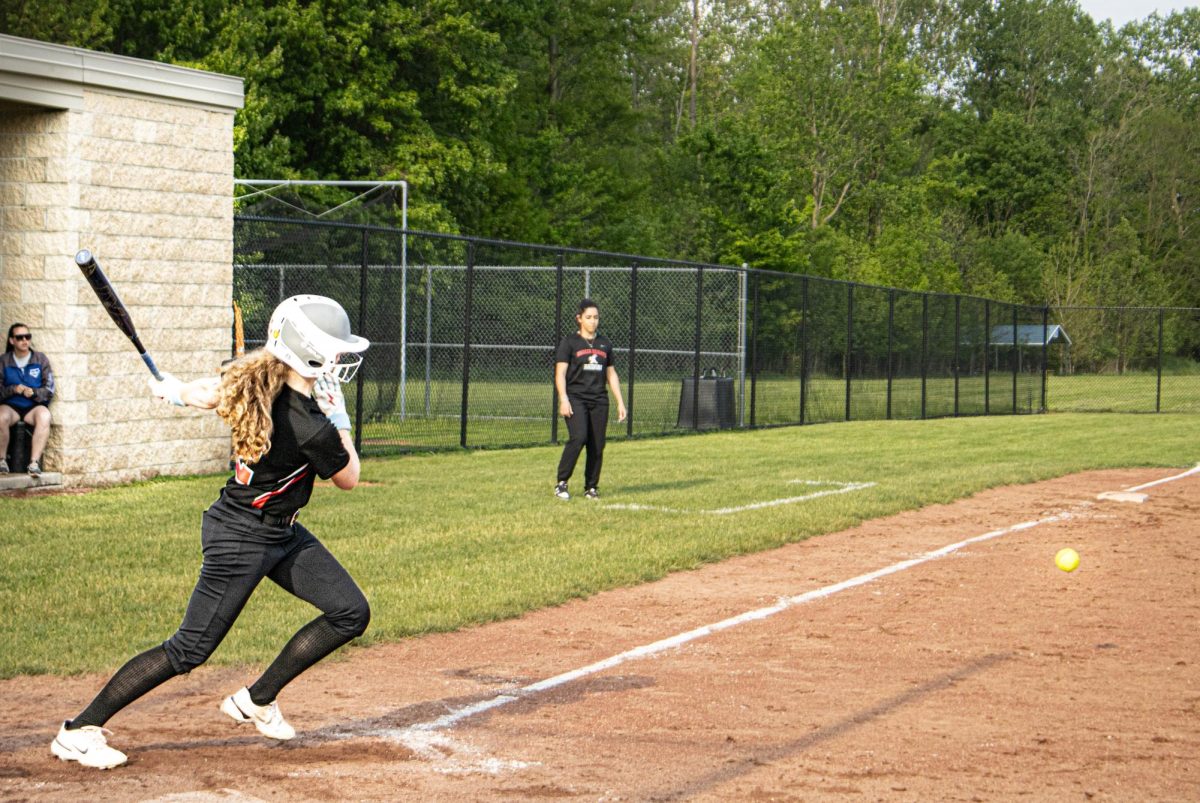 Molly Milligan, a junior, makes contact during a 10-1 loss to Brunswick May 15. Milligan switched to softball this year after two years in the outfield for the baseball team.